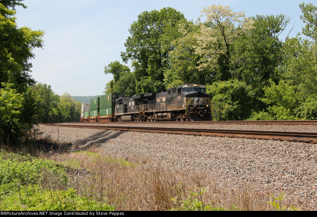 NS 4354 and 7650 take a stack train east through Cove PA